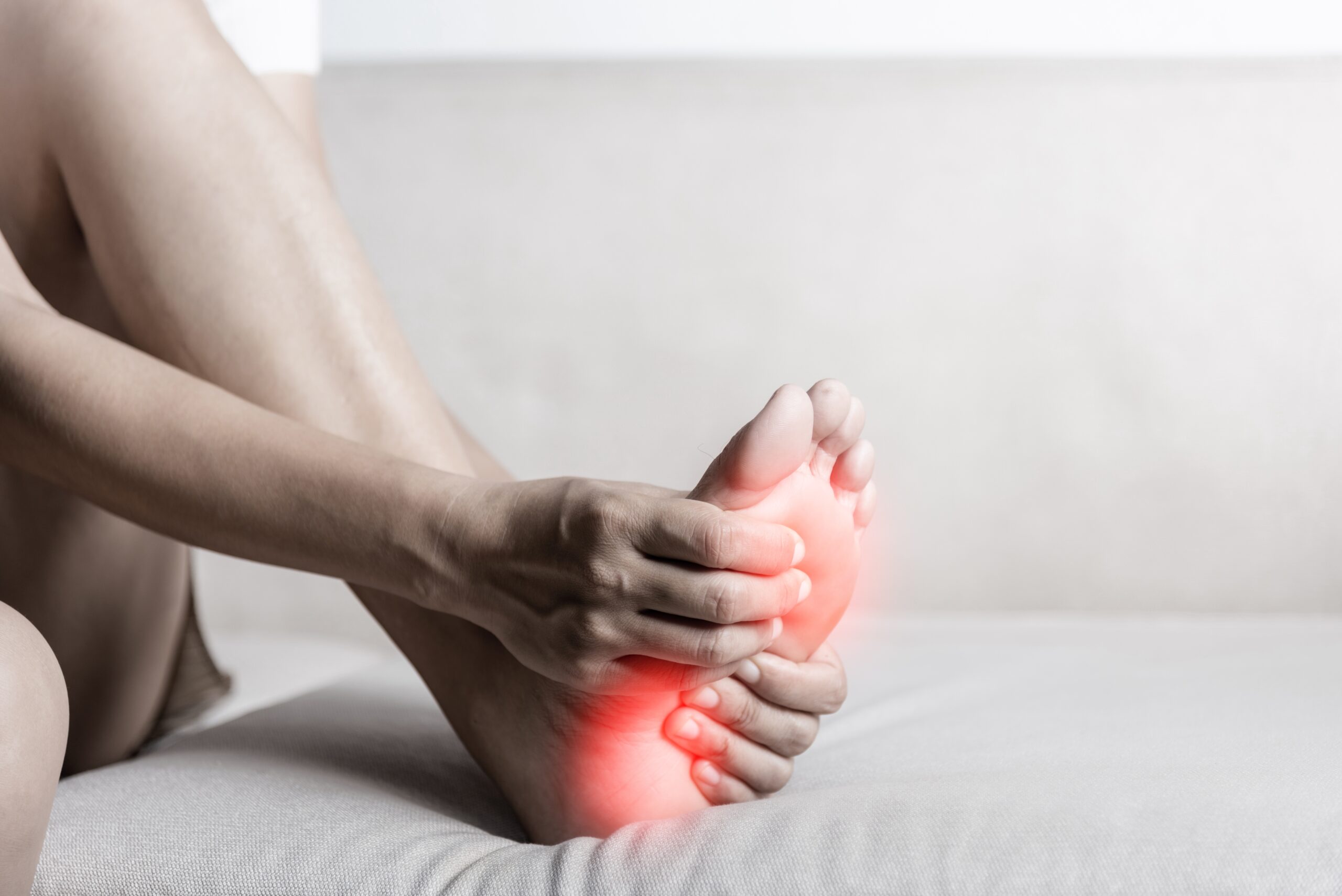 Foot,Pain,,Asian,Woman,Sitting,On,Sofa,Feeling,Pain,In Neuropathy Relief